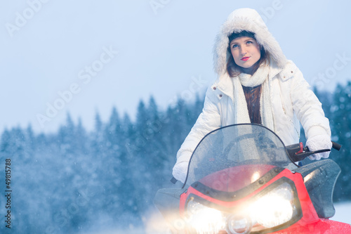 Photo: Woman and snowmobile Woman and snowmobile