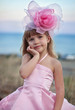 Photo: Beautiful little girl in a pink dress walking Beautiful little girl in a pink dress walking