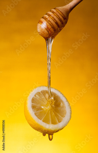 Photo: Honey flowing on lemon Honey flowing on lemon