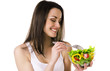 Photo: Beautiful young girl eats salad Beautiful young girl eats salad