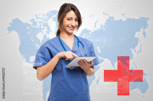 Photo: Female doctor using a tablet Female doctor using a tablet