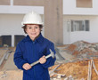 Happy little boy with a hammer