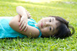 Child lying on grass