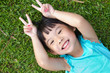 Child lying on grass