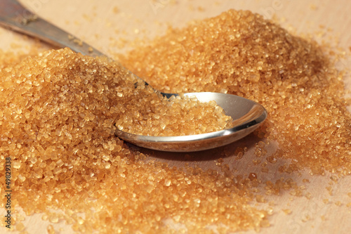Photo: Raw brown sugar with a spoon Raw brown sugar with a spoon