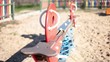 Video: Colorful play equipment in the sand on a playground Colorful play equipment in the sand on a playground
