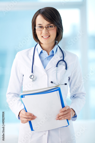 Photo: Clinician with documents Clinician with documents