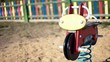 Video: Colorful play equipment in the sand on a playground Colorful play equipment in the sand on a playground