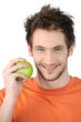 young man with orange shirt holding apple