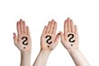three hands with question marks
