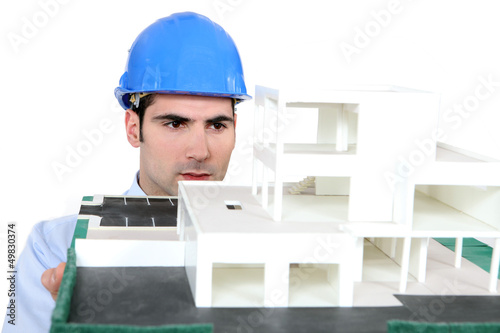 Photo: Architect holding his building model Architect holding his building model