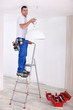 Handyman fixing lighting