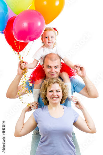 Photo: kid with parents celebrating birthday and blowing candles on ca kid with parents celebrating birthday and blowing candles on ca
