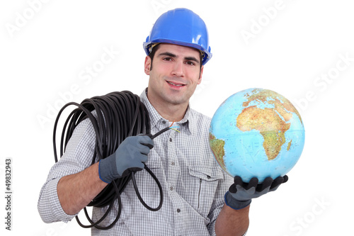 Photo: Electrician holding globe Electrician holding globe