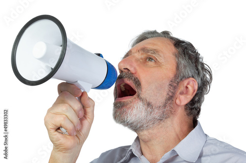 Photo: An elderly man shouts into megaphone An elderly man shouts into megaphone