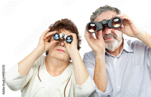Photo: Elderly couple looks through binoculars Elderly couple looks through binoculars