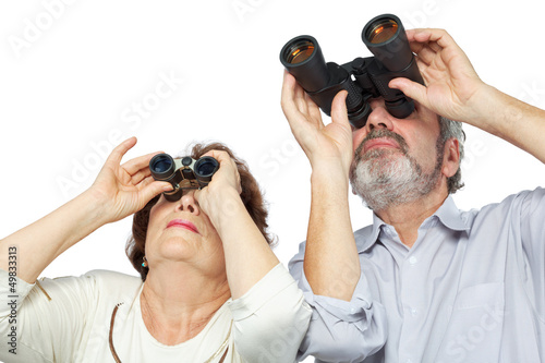Photo: Elderly couple looks through binoculars Elderly couple looks through binoculars