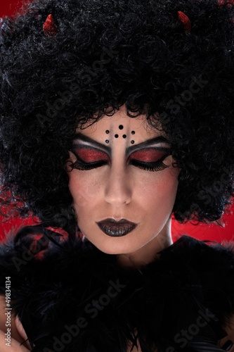 Photo: Closeup portrait of evil woman Closeup portrait of evil woman
