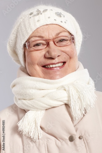 Photo: Closeup portrait of old lady at winter Closeup portrait of old lady at winter