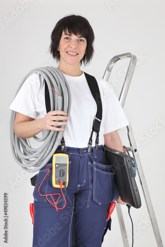 Photo: Female electrician ready to work Female electrician ready to work