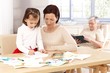 Mother and daughter drawing