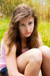 Photo: teenage girl looks serious outside in sunlight teenage girl looks serious outside in sunlight