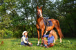 Two Beautiful Smiling Cowgirls with horse
