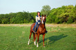 pretty young woman riding horse