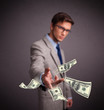 Young man throwing money