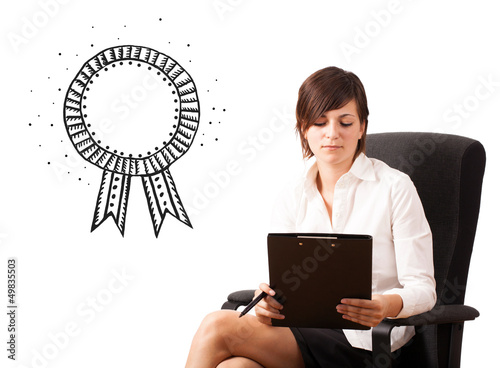 Photo: Young business woman presenting a ribbon Young business woman presenting a ribbon