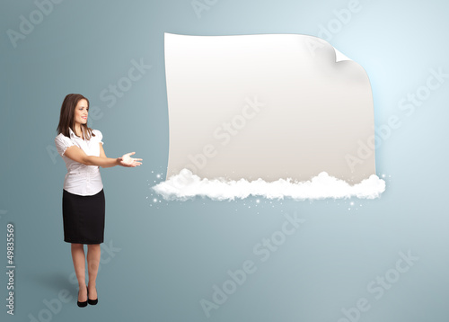 Photo: pretty woman presenting modern copy space on clouds pretty woman presenting modern copy space on clouds
