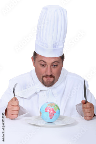 Photo: cook with globe on a plate cook with globe on a plate