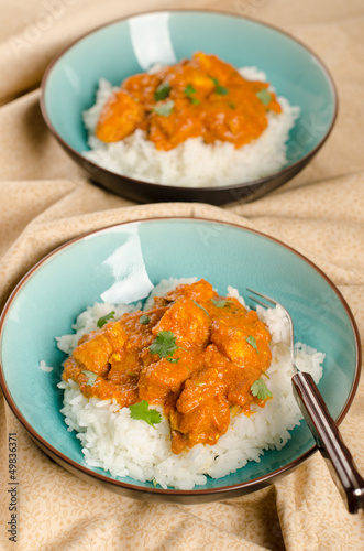 Photo: Indian dish - Chicken tikka masala served with rice and garnishe Indian dish - Chicken tikka masala served with rice and garnishe