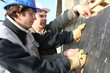 craftsman and apprentice working together