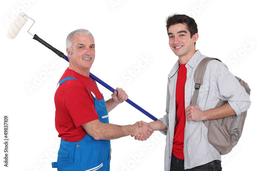 Photo: Painter and young man shaking hands Painter and young man shaking hands