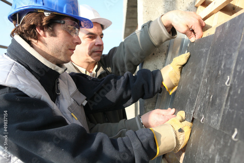 Photo: craftsman and apprentice working together craftsman and apprentice working together
