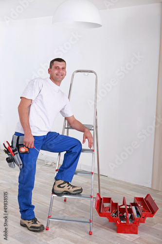 Photo: Electrician installing light Electrician installing light
