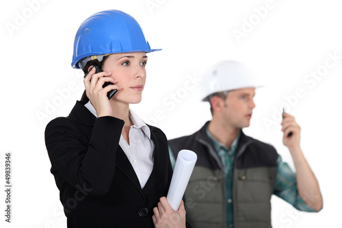 Photo: businesswoman and craftsman businesswoman and craftsman