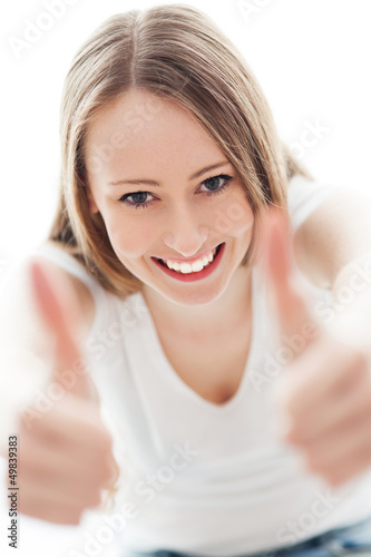 Photo: Young woman with thumbs up Young woman with thumbs up