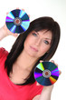 Woman holding CDs on white background