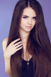 Beautiful woman with long brown hair. Closeup portrait of fashio