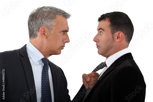 Photo: Boss threatening employee Boss threatening employee