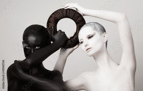 Photo: Women in Ying Yang Style. Occult Contrast Make-up. Unity Women in Ying Yang Style. Occult Contrast Make-up. Unity