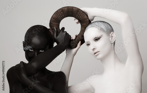 Photo: Yin & Yang Esoteric Symbol. Black & White Women Silhouettes Yin & Yang Esoteric Symbol. Black & White Women Silhouettes