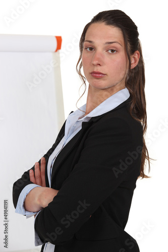 Photo: Brunette giving a presentation. Brunette giving a presentation.