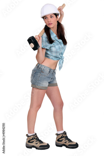 Photo: Attractive female builder with sledge-hammer Attractive female builder with sledge-hammer