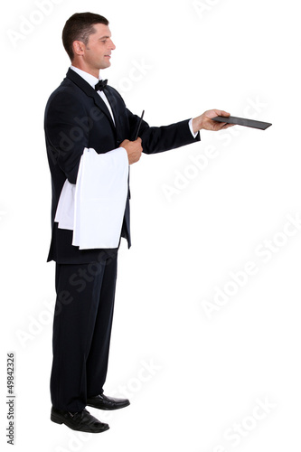 Photo: Profile view of male waiter holding out menu Profile view of male waiter holding out menu