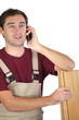 carpenter talking on the phone