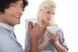 Foto: young couple drinking coffee together young couple drinking coffee together