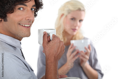 Photo: young couple drinking coffee together young couple drinking coffee together